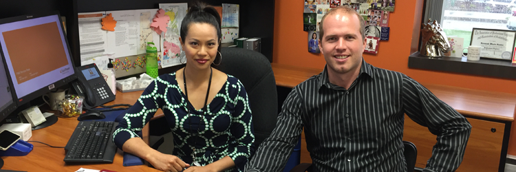 Two employees at desk